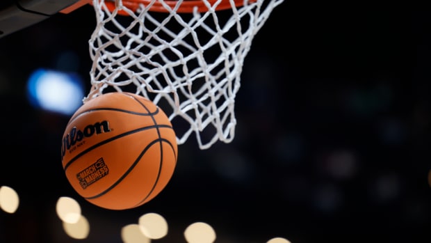 A basketball displaying the March Madness logo enter the basket before the game between the USC Trojans and the Michigan State Spartans at Nationwide Arena.